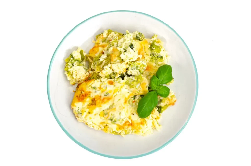 Cottage Cheese in Scrambled Eggs - A plated dish of cottage cheese scrambled eggs with herbs