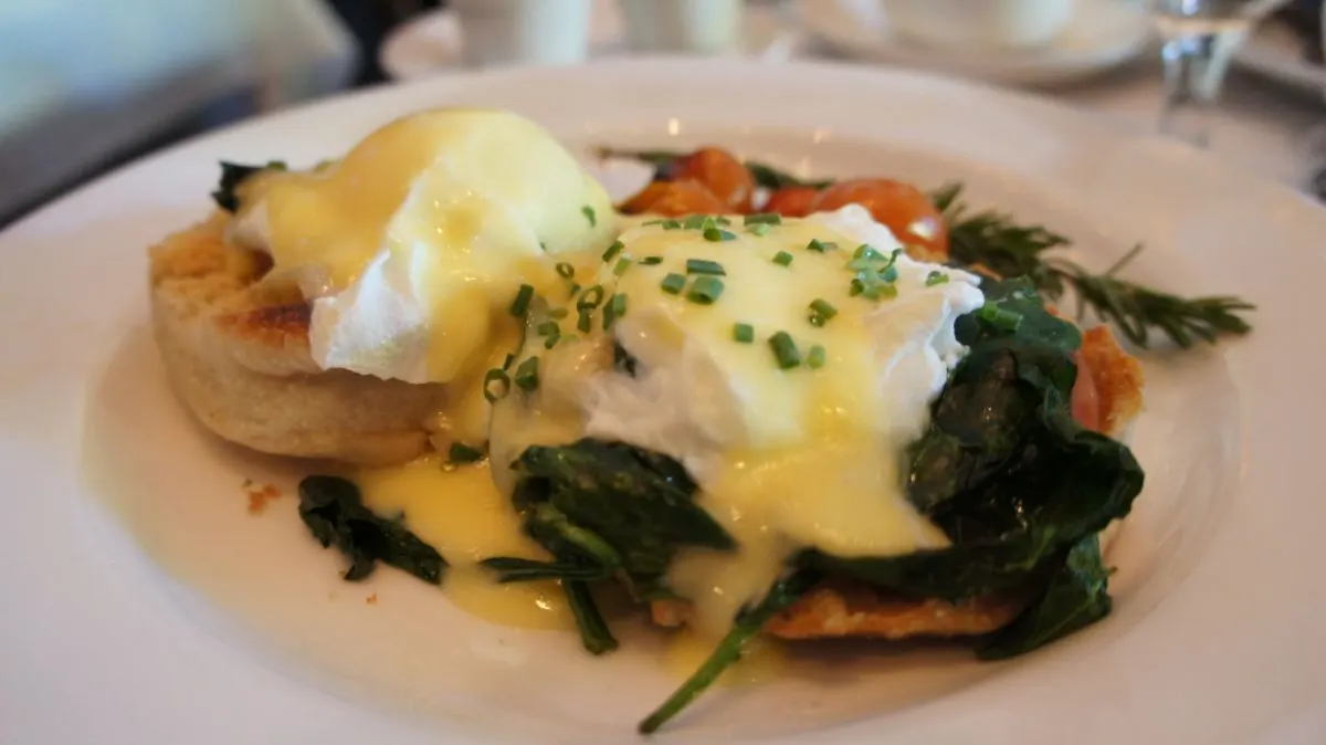 Close-up of Eggs Benedict Florentine on an English muffin