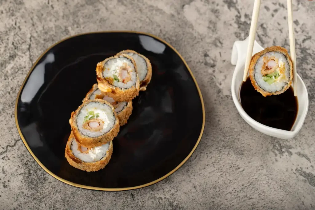 plated chicken tempura roll with dipping sauce