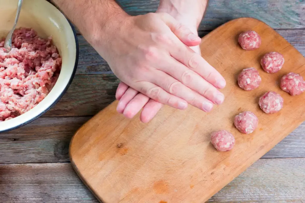 shaping alfredo meatballs- alfredo meatballs